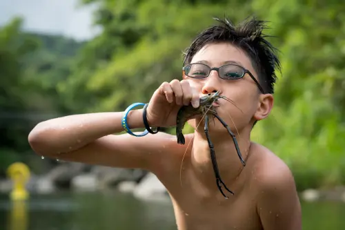 Lucas showing off his catch. Fresh shrimp!