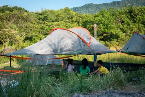 Morning business meeting. Campers busy planning the days adventures.