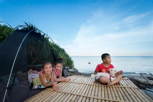 Three little campers enjoying their own private campground and beach.